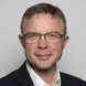 A head and shoulders portrait photograph of RCR president Stephen Harding