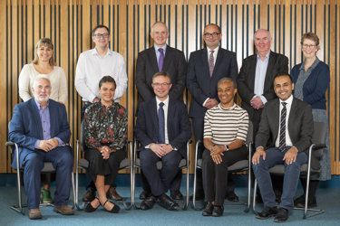 A group portrait of the RCR trustees for autumn 2025, five people standing and sitting 