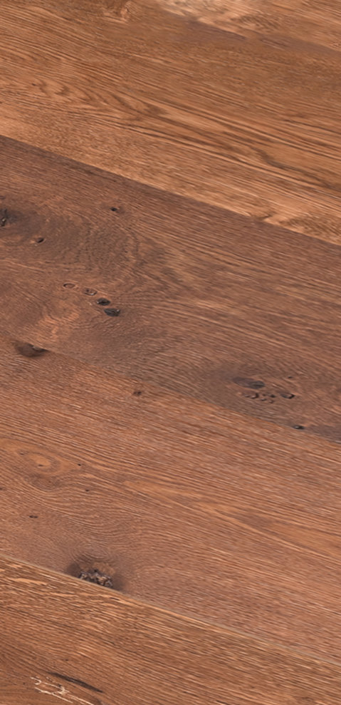 A pile of Wave Winter 2024 magazines on wooden table