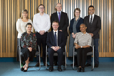 A group portrait of the RCR officers for autumn 2025, five people standing and sitting